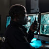security officer using radio for communication in restricted environment