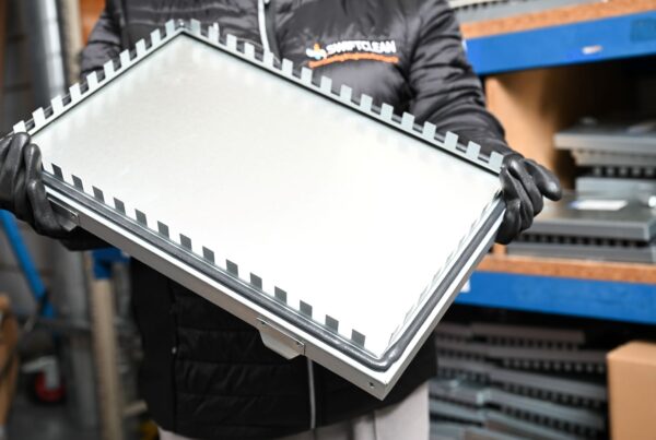 Swiftclean engineer removing ductwork access panel for inspection